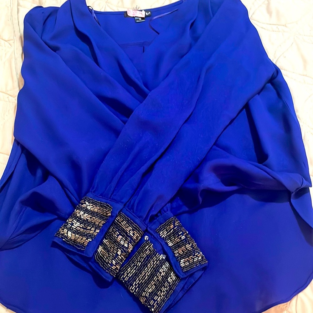 Going out blue top w sequins. Size M but fits an S.